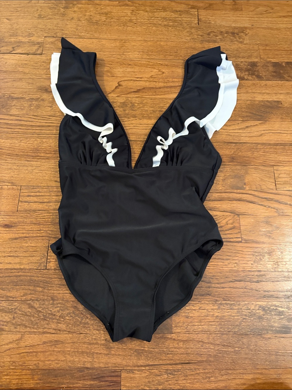 Black One-Piece Swimsuit with White Ruffle Trim